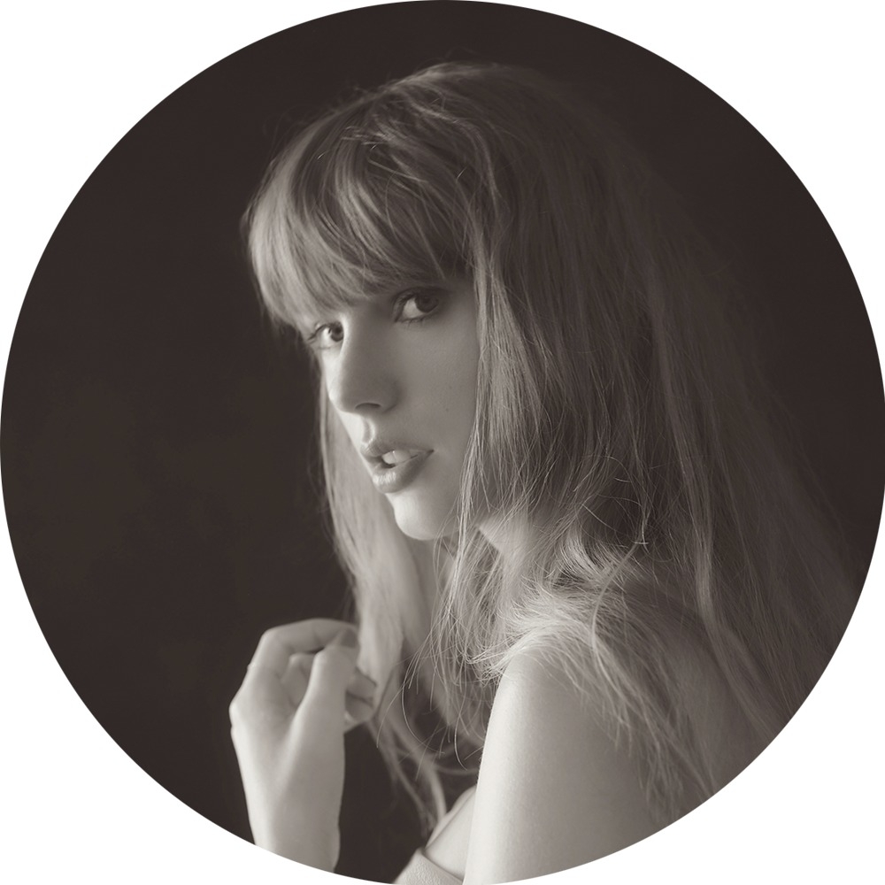 black and white photo of Taylor Swift looking at the camera from the side