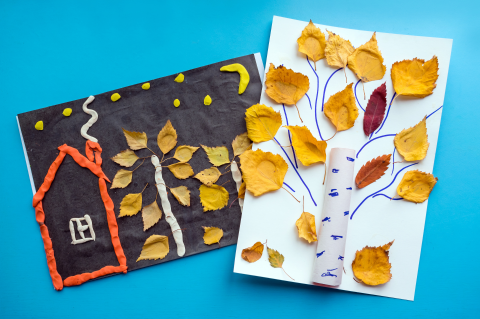 children's art made with leaves and playdough