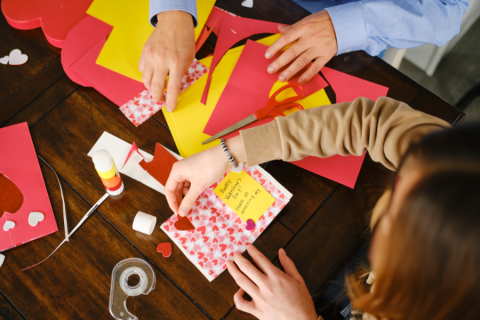 top down view of two people making cards