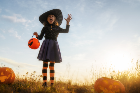 little girl dressed as a witch