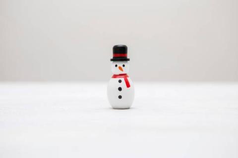 small snowman made from a bowling pin