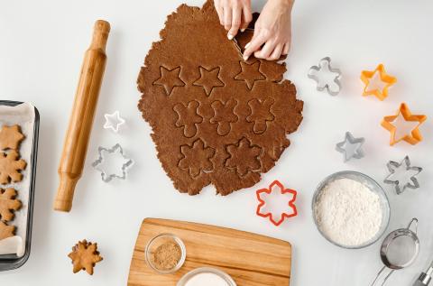 cookies being cut out of dough