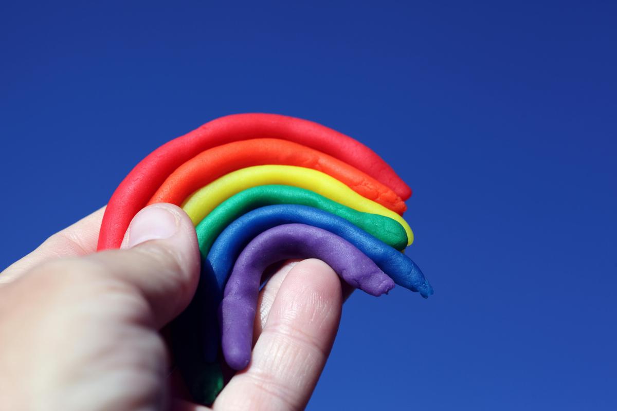 rainbow made of playdough held up to the sky