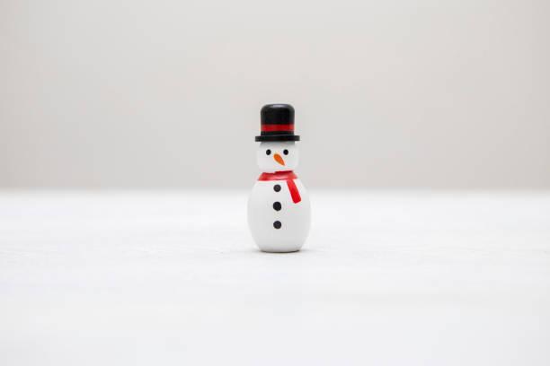 small snowman made from a bowling pin
